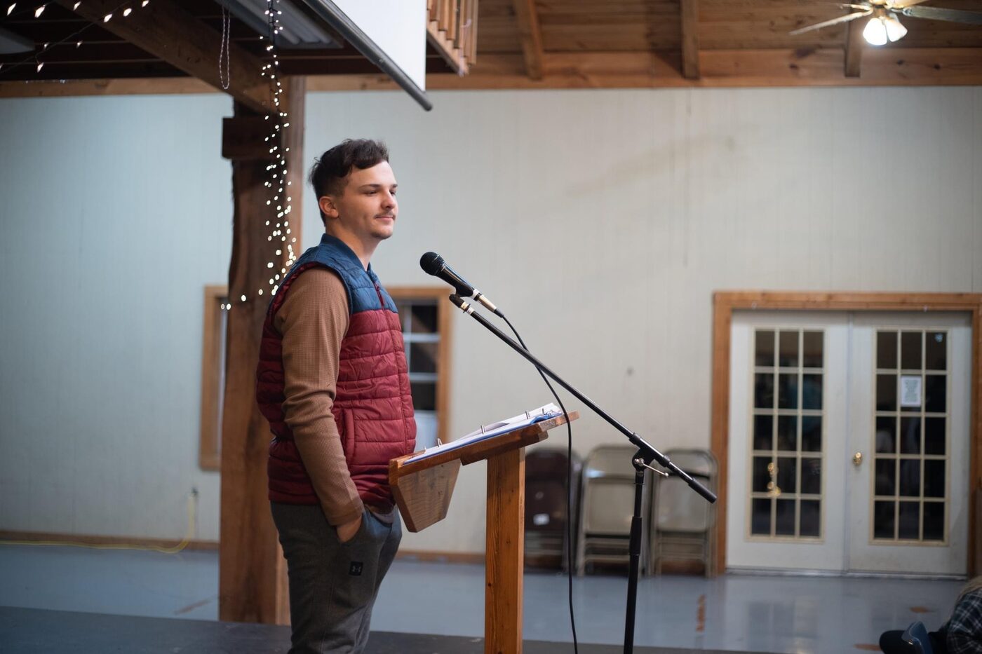 Caleb Wright preaching at a podium